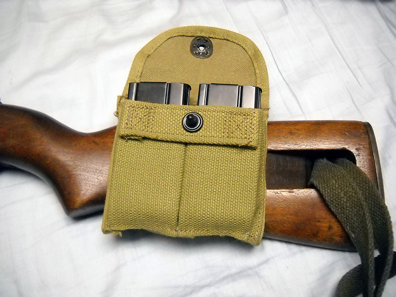detail, M1 carbine ammunition pouch, flap open, with two 15-round magazines